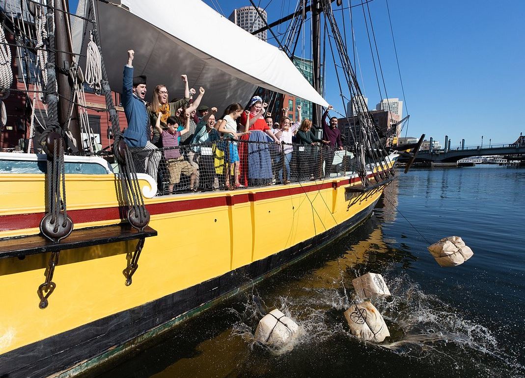 Image of a Boston Tea Party reenactment.