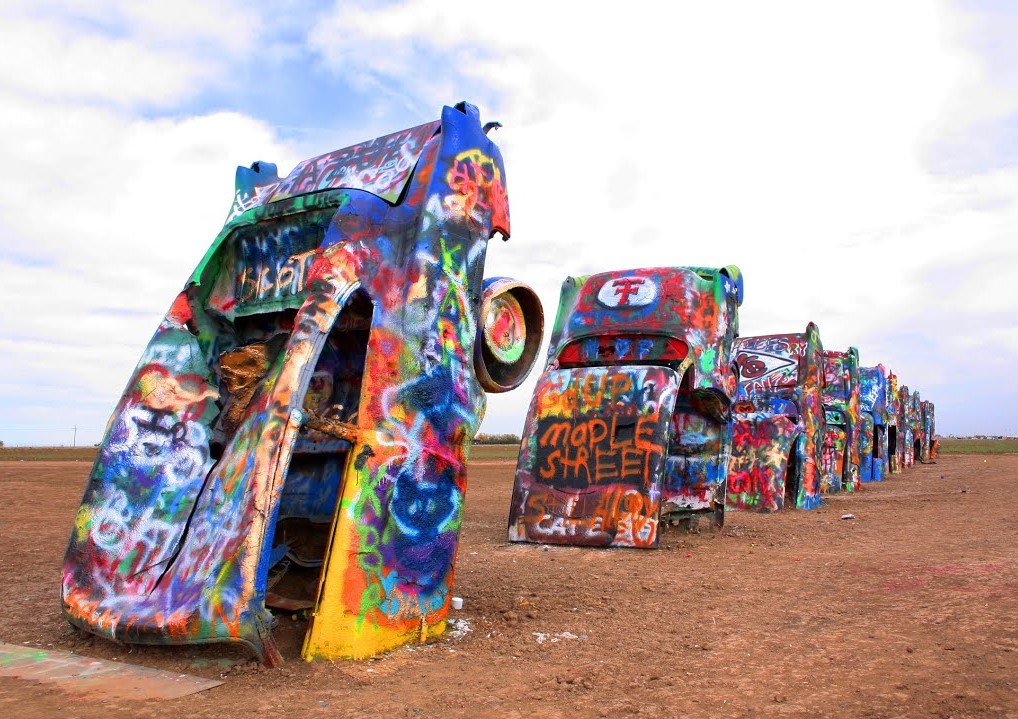 Best Texas Road Trips for Families Stop at Cadillac Ranch near Amarillo for some cool photos on your roadtrip to the Texas Panhandle.